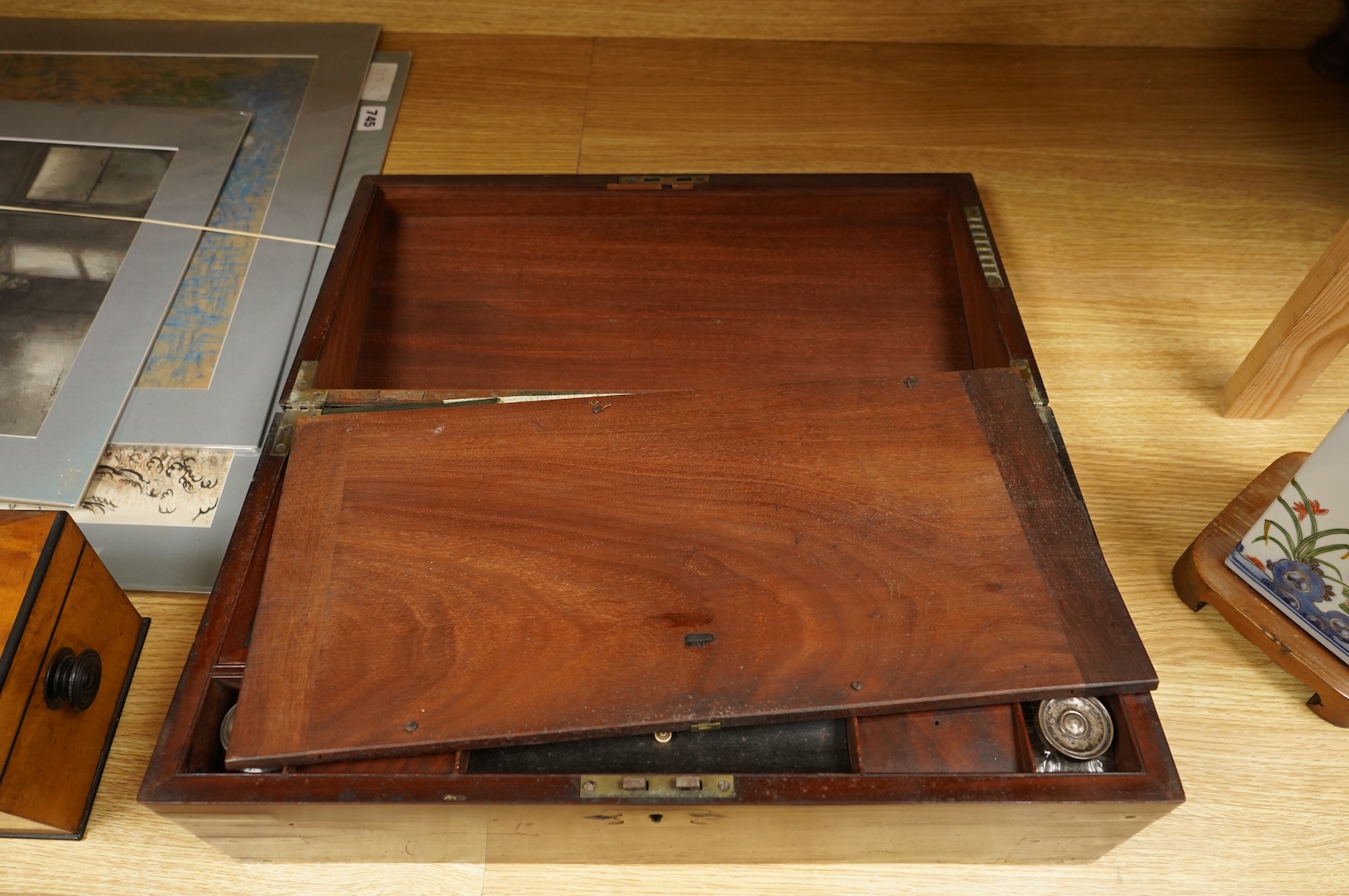 A bird’s-eye maple tea caddy and a brass mounted writing slope, latter 50cm wide